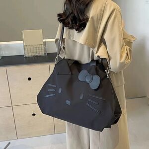 Hello Kitty Black Tote with Bow Accent duffle crossbody bag removable strap